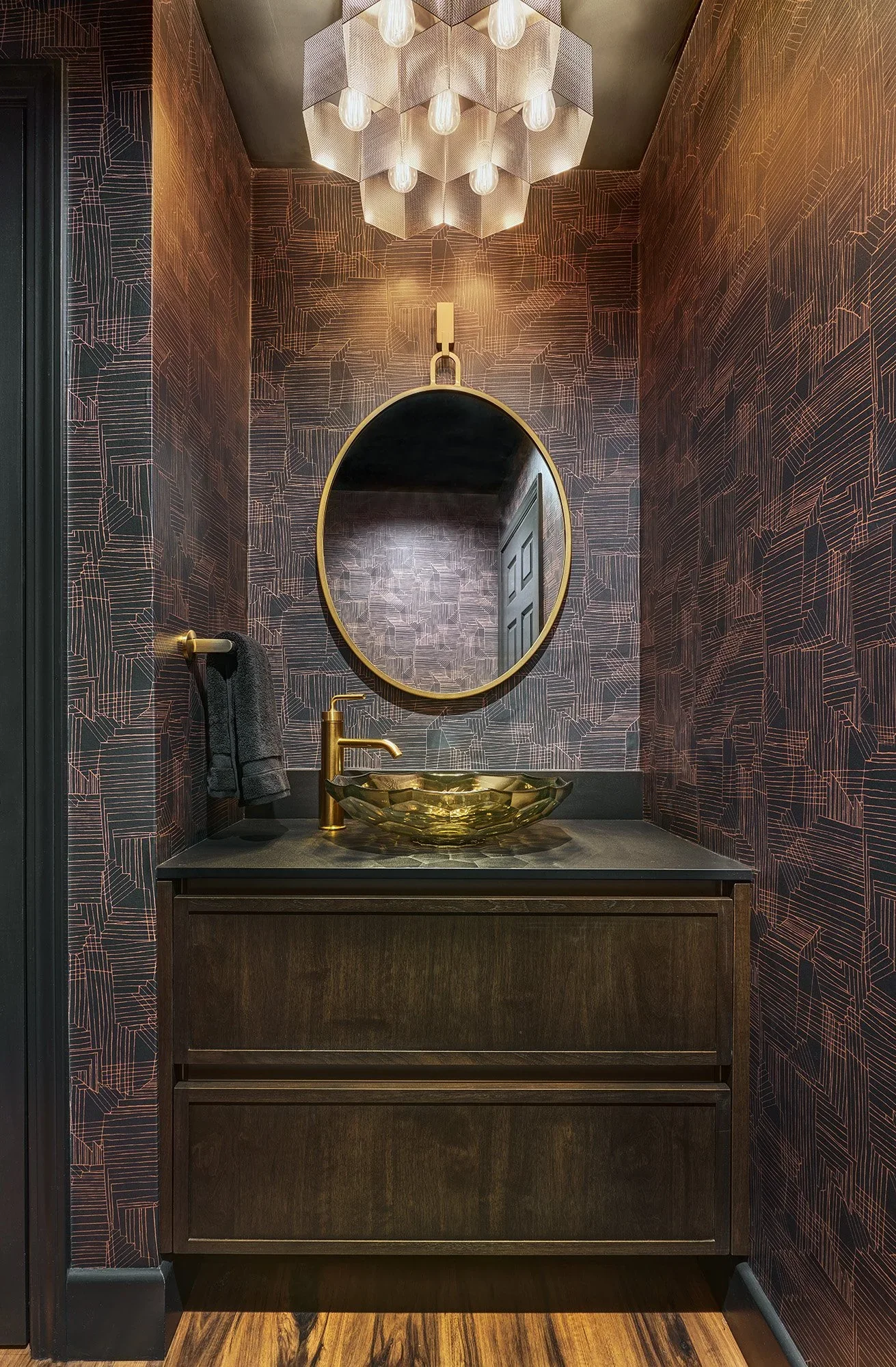 Moody powder bathroom remodel, European wood cabinet vanity, glass vessel sink, wallpaper