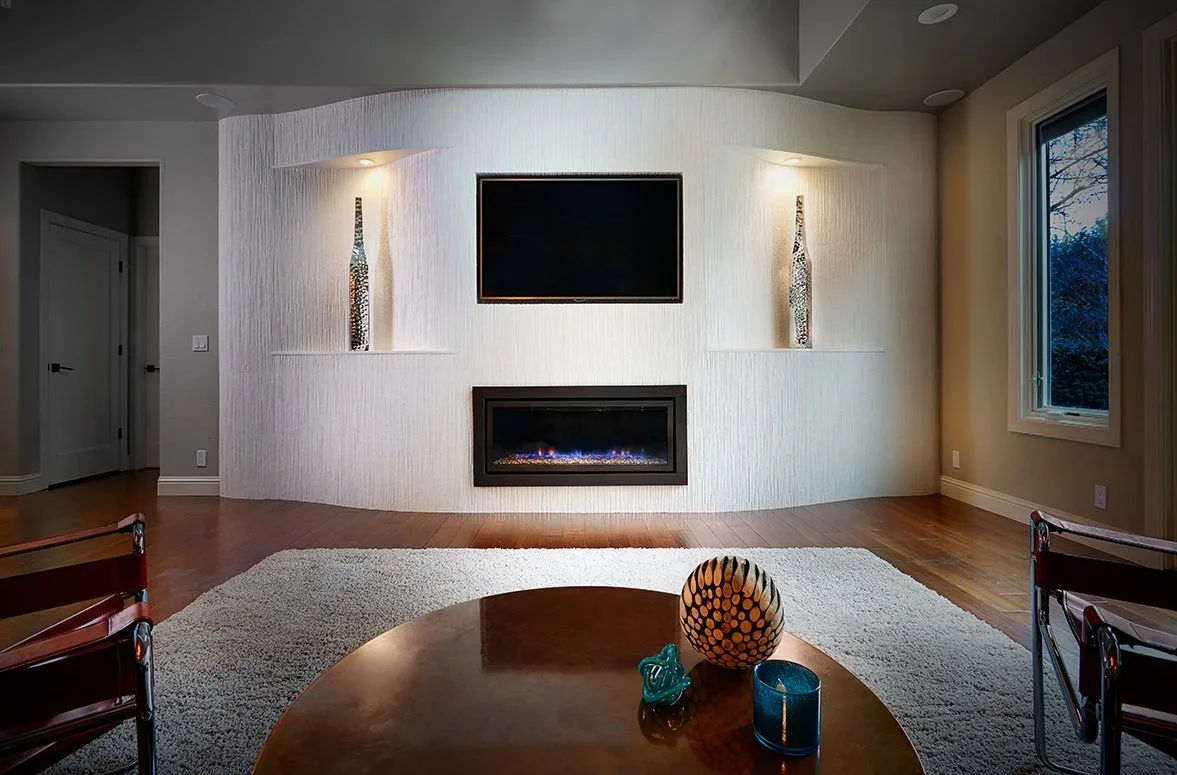 Fireplace wall with curves, tiled, inset TV, art display niches