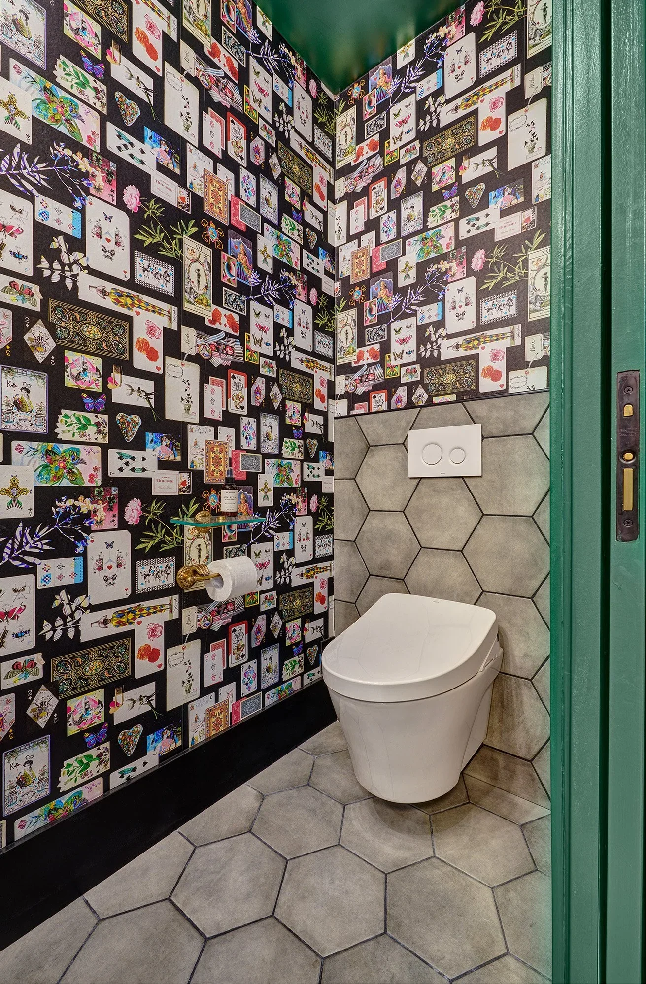 Green powder bath, card wallpaper, wall hung toilet, hex tile, white oak cabinet vanity