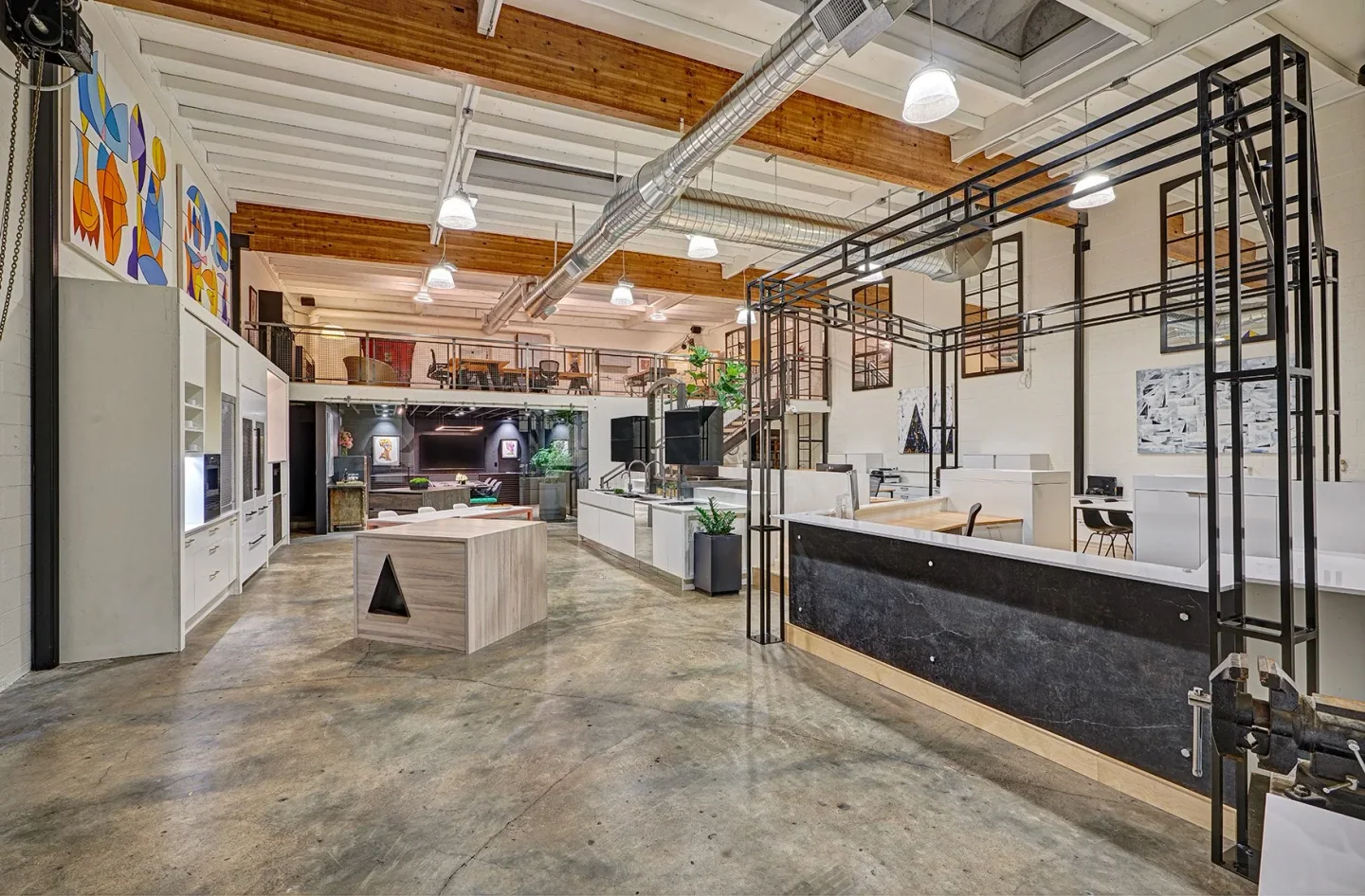NAR’s Sacramento studio, with exposed timber, tall windows, and material-filled working spaces