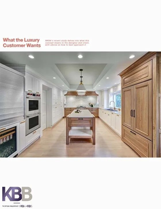Modern kitchen with wooden and white cabinetry, central kitchen island, stainless steel appliances, and a window with a view outside.
