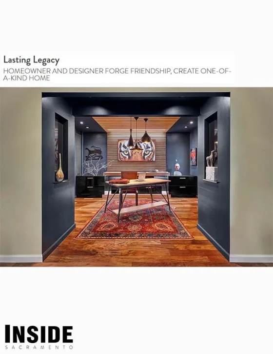 Interior view of a modern home office with dark walls, wooden flooring, and eclectic artwork, including a large tiger face painting, from the INSIDE Sacramento publication.