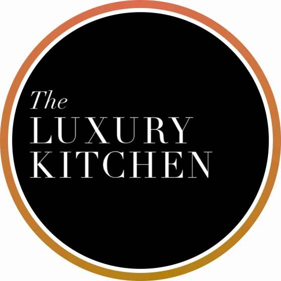 Logo for The Luxury Kitchen with black circle, white text, and gold and white outer rings.