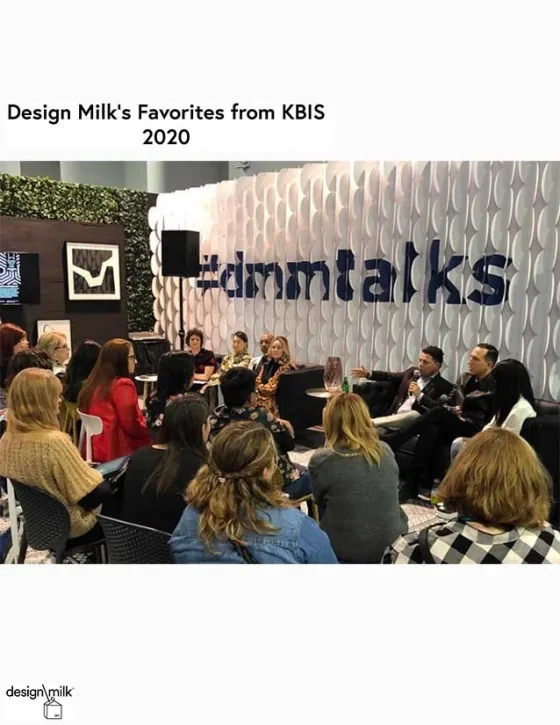 A panel of speakers at a Design Milk event discussing digital talks, with an audience seated and listening, in front of a decorative wall with the design milk logo.