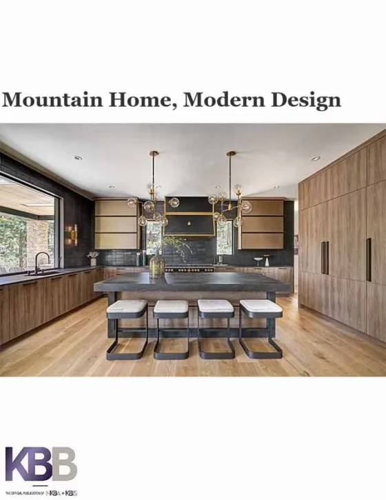 Cover of a modern kitchen design magazine titled 'Mountain Home, Modern Design' featuring a spacious kitchen with wooden cabinets, a large island with seating, black backsplash, and contemporary pendant lighting.